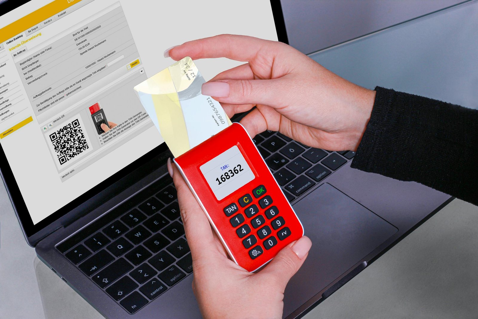 A person using a hardware security key and authenticator app for two-factor authentication