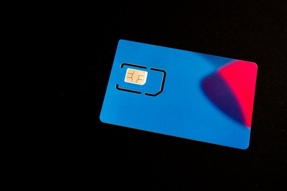 Blue SIM card on dark background representing eSIM attack surface