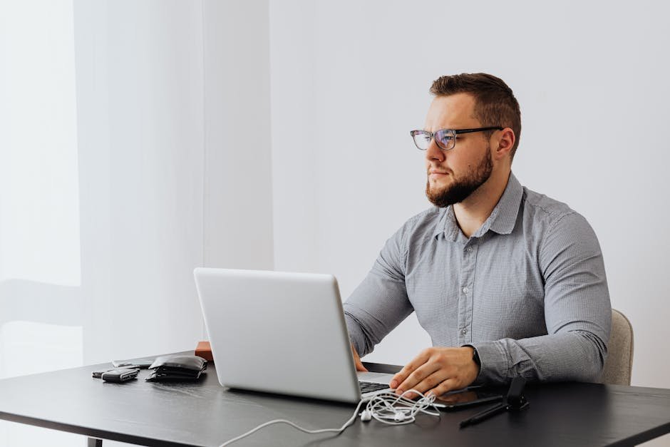 Security analyst auditing infrastructure on a laptop